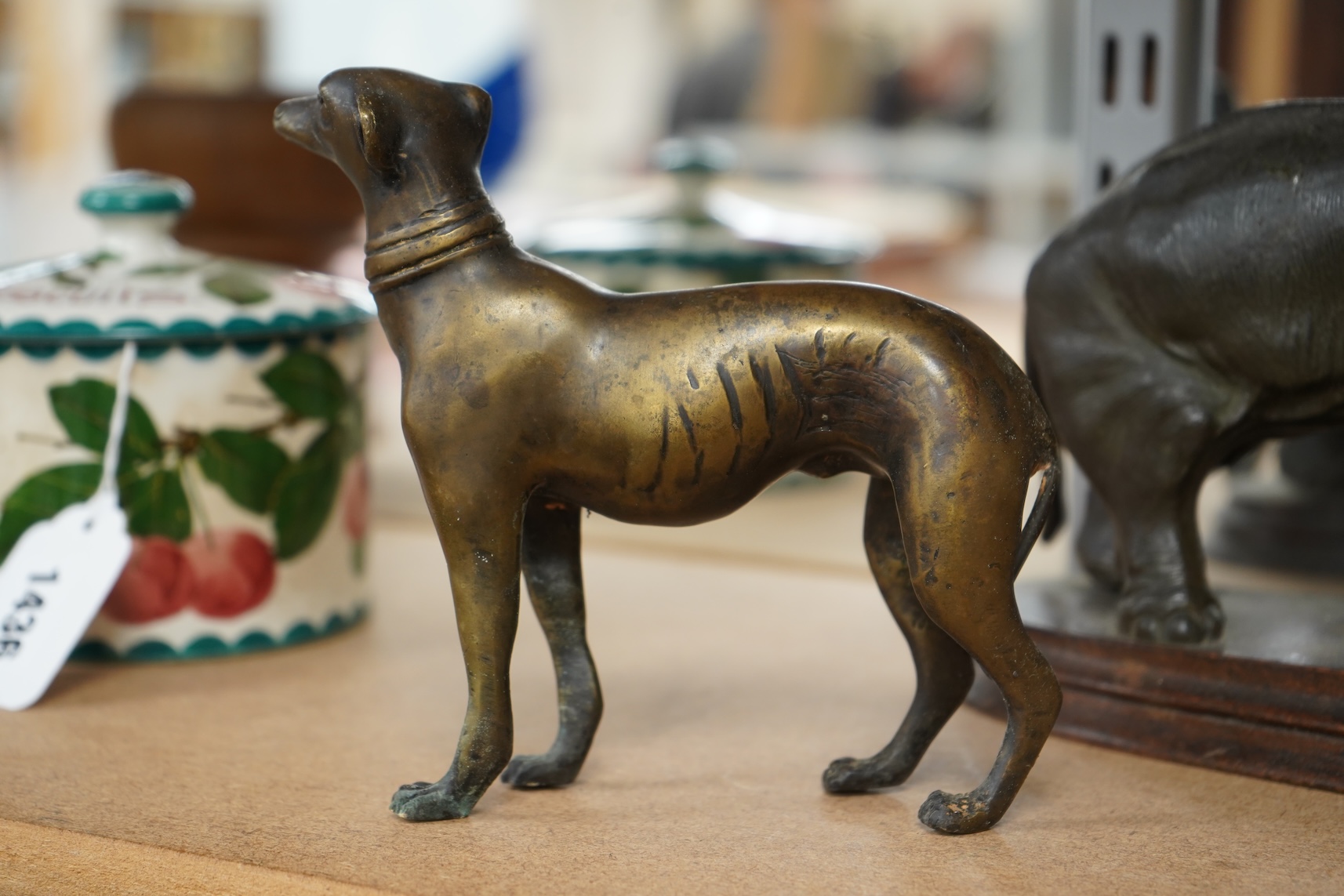 A bronzed metal model of an elephant and a bronze model of a greyhound, tallest 20cm